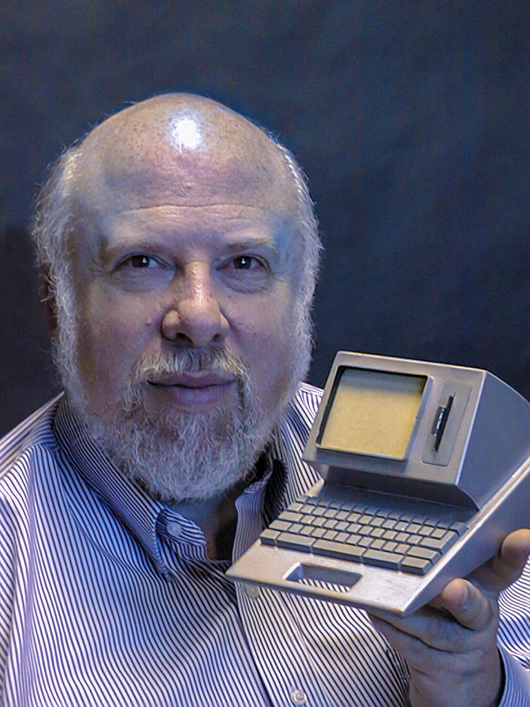Jef Raskin holding a Canon Cat model